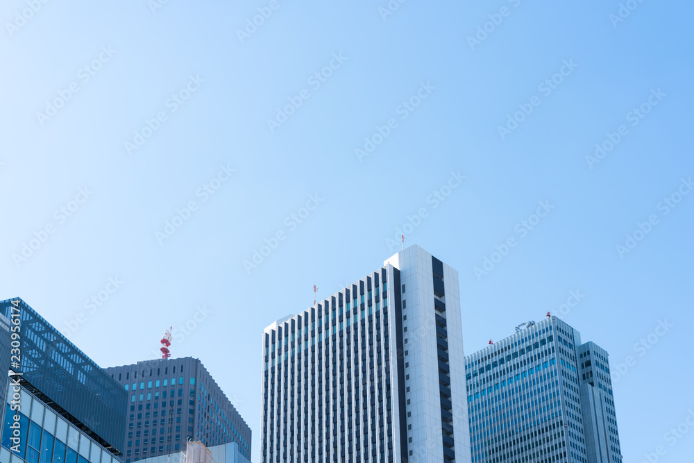 Business image -  Office building against the blue sky 
