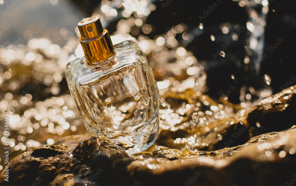 perfume with water drops at sea bacground perfume with water drops at sea bacground
