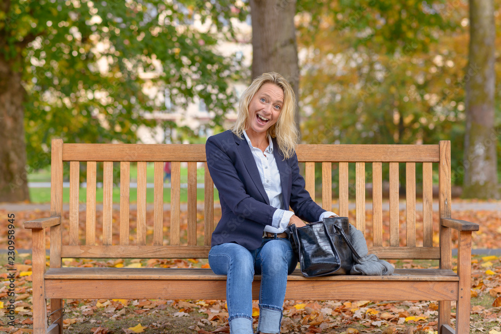 Attractive blond woman with a delighted smile