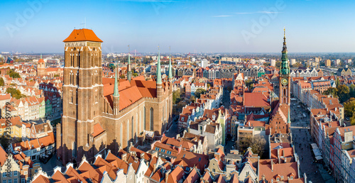 Gdansk, Poland. Panorama of old city with St Mary church, town hall tower, Dluga (Long) Street, and old historic houses.  Aerial view in sunset light