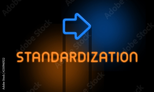 Standardization - orange glowing text with an arrow on dark background