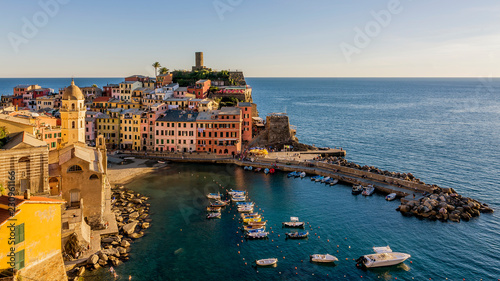 Aerial view of the historic center of Vernazza illuminated by the golden light of the sunset, Cinque Terre, Liguria, Italy