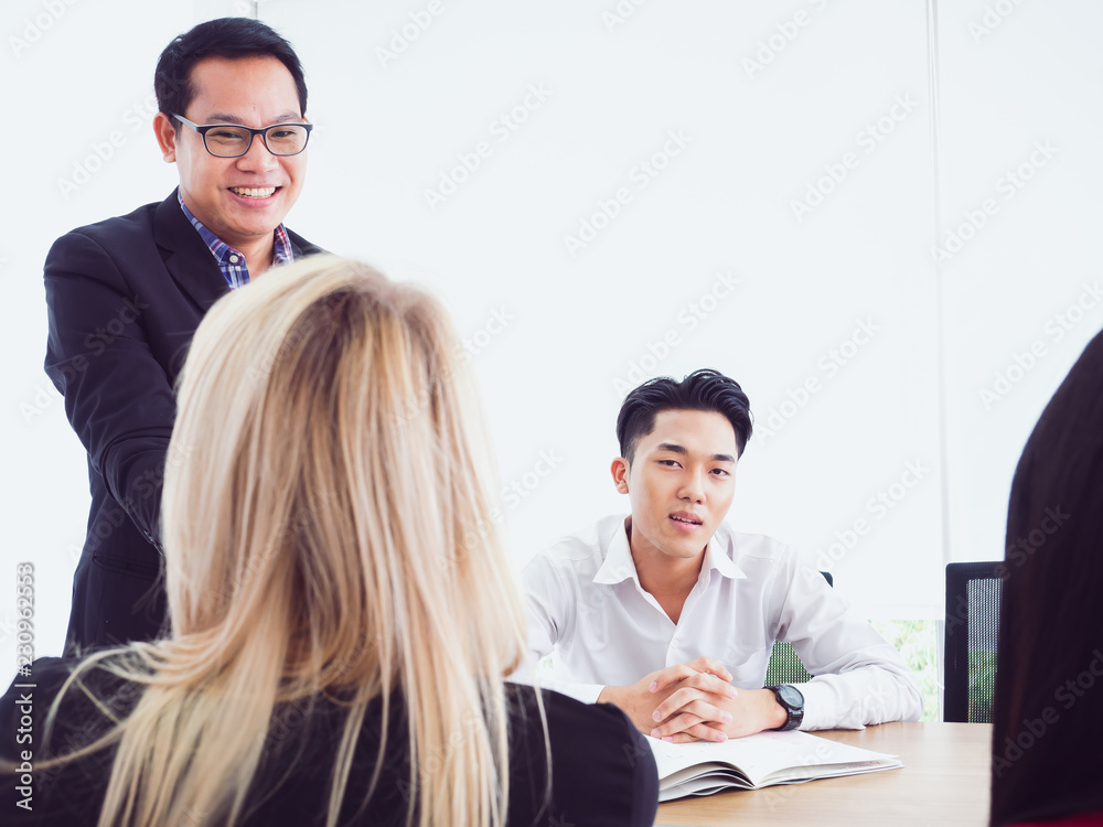 business people in meeting room,Business team explaining new business ideas business people in meeting room,Business team explaining new business ideas