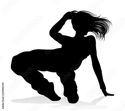 A woman street dance hip hop dancer in silhouette photo