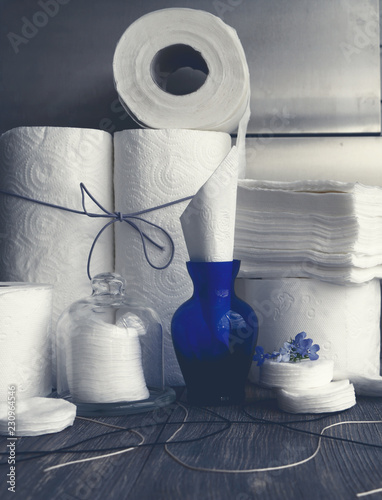 White paper rolls - towels and toilet paper, cotton pads and napkins.