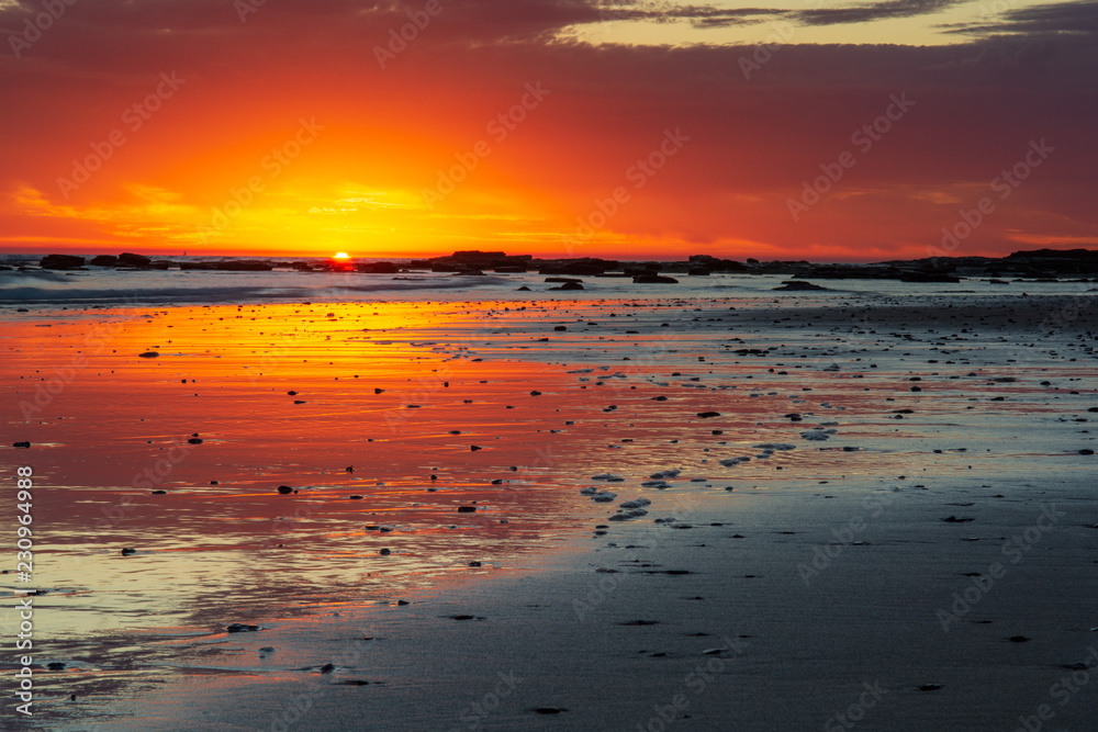 Stunning sunrise at Long Reef Point, Australia. Amazing light and reflections and dawn on Sydney's northern beaches. Stunning sunrise at Long Reef Point, Australia. Amazing light and reflections and dawn on Sydney's northern beaches.