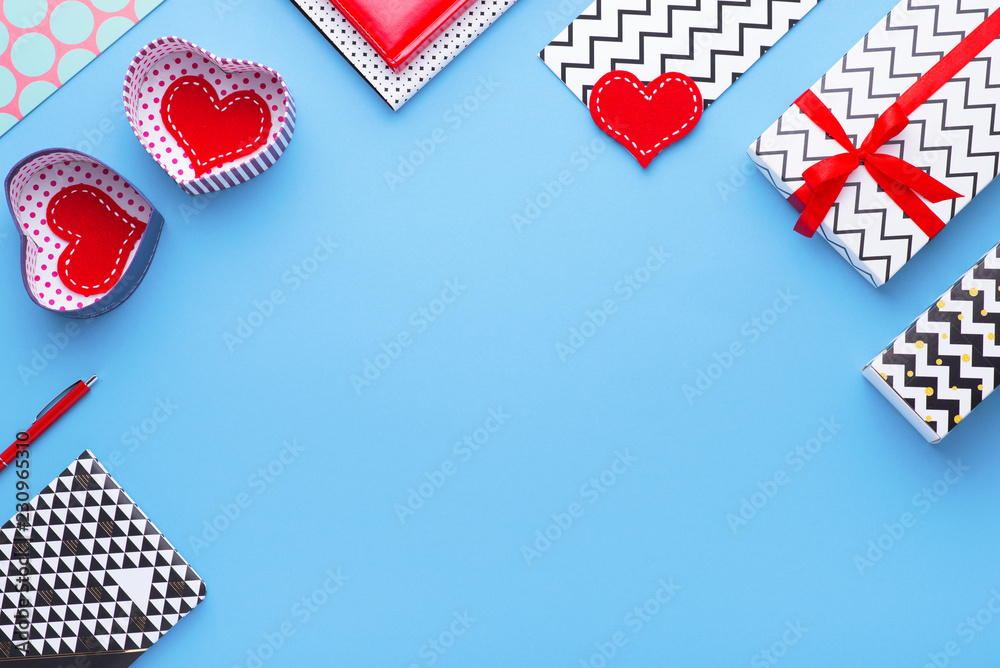 Fototapeta premium Person holding a present for Saint Valentine's day in his hands. Beautiful colorful background to st. Valentine day. Greeting card with red hearts. Wedding's invitation. Love expression. 