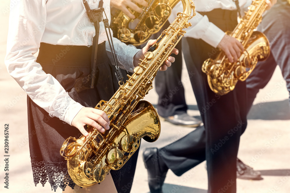 Fototapeta premium A group of teenagers playing in a school orchestra