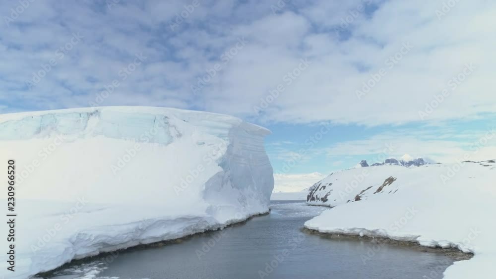 Ocean Pass Through Iceberg And Snow Antarctica Land. Aerial Drone Flight Overview. Ice And Snow Covered Glaciers Of Antarctic Continent. Winter Polar Landscape. Wilderness. 4k Footage. Ocean Pass Through Iceberg And Snow Antarctica Land. Aerial Drone Flight Overview. Ice And Snow Covered Glaciers Of Antarctic Continent. Winter Polar Landscape. Wilderness. 4k Footage.