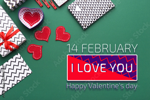 Person holding a present for Saint Valentine's day in his hands. Beautiful colorful background to st. Valentine day. Greeting card with red hearts. Wedding's invitation. Love expression.  photo