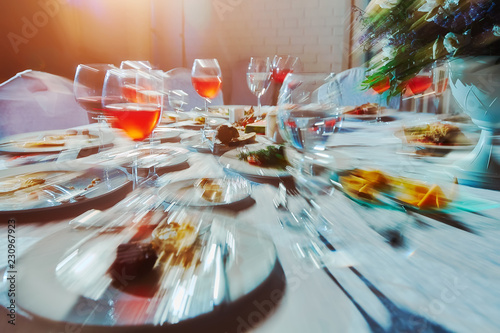 Obraz na plátne Banquet table with food, as he sees a drunk man, an alcoholic who drank a lot of