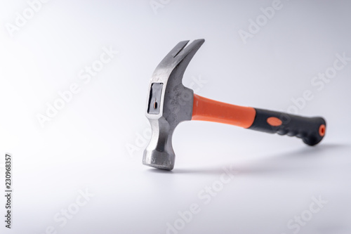 Hammer closeup on white background with selective focus and crop fragment