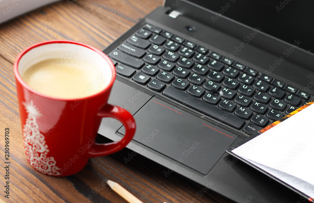 Laptop on the desktop and a cup of coffee. Laptop on the desktop and a cup of coffee.