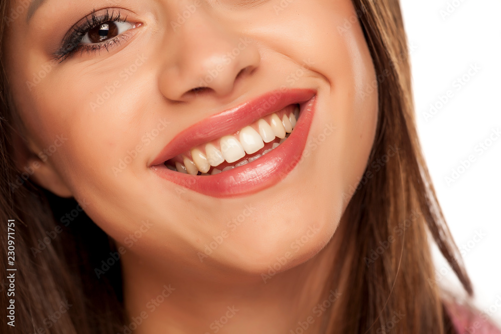 Smiling woman with natural and healthy teeth Smiling woman with natural and healthy teeth