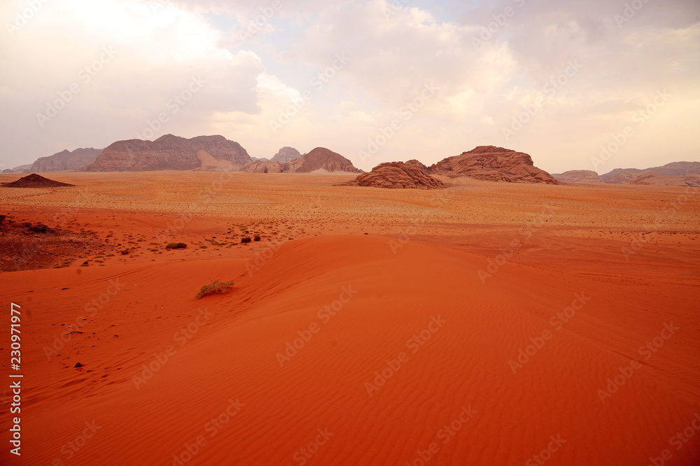 panoramic view of wadi rum desert lookin like mars planet with rocks and red sand panoramic view of wadi rum desert lookin like mars planet with rocks and red sand