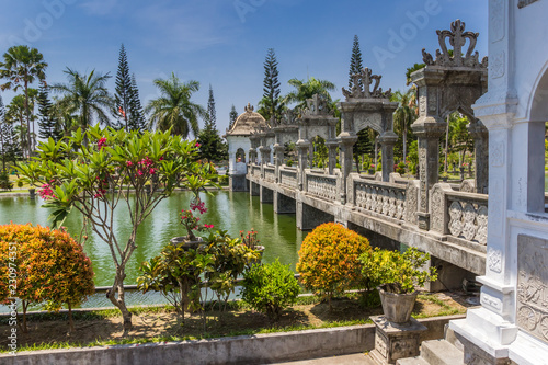 Bridge of Taman Ujung Soekasada water palace on Bali, Indonesia photo