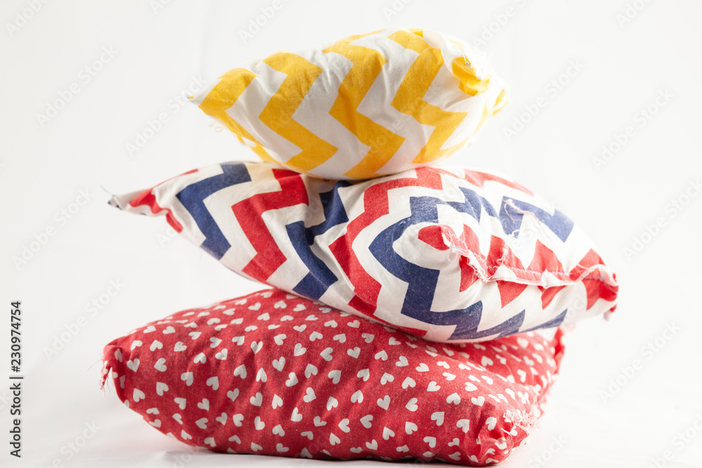 Fototapeta premium three multi-colored pillows