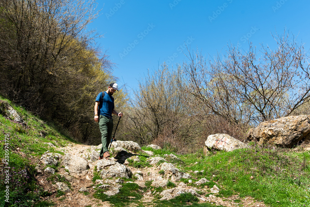 Fototapeta premium Man hiking on a sunny day