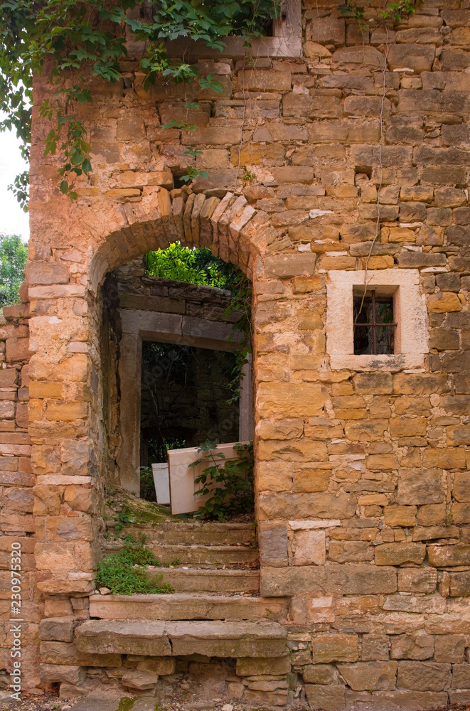 Naklejka premium An old doorway in the historic hill village of Oprtalj in Istria, Croatia 