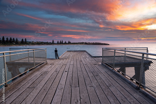 Fototapeta Naklejka Na Ścianę i Meble -  A beautiful Sunrise over the iconic port elliot jetty in horseshoe bay port elliot south australia on 1st november 2018