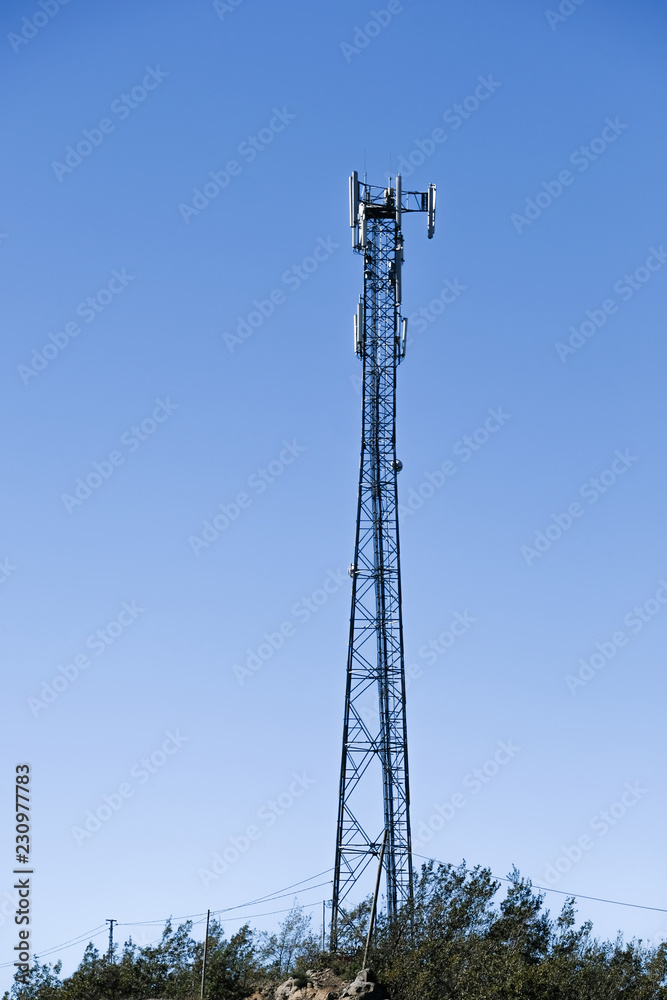 Cellular radio tower antenna. Mobile GSM Base Station Tower with blue sky. Cellular radio tower antenna. Mobile GSM Base Station Tower with blue sky.