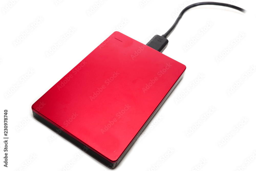 Red external hard disk isolated on white background. Red external hard disk isolated on white background.