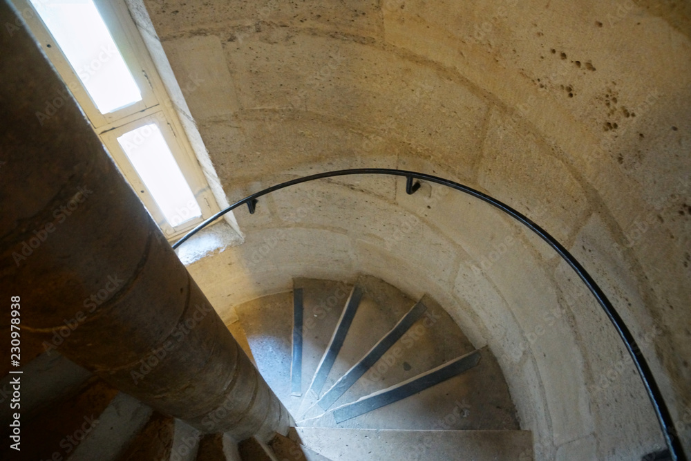 Fototapeta premium Old spiral staircase in the tower top view