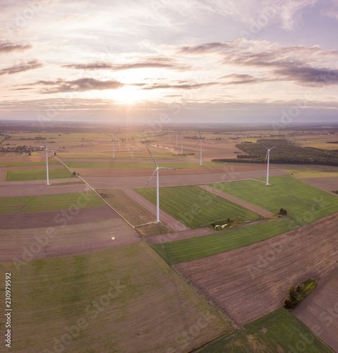 Aerial  FIelds and windmills in sunset light