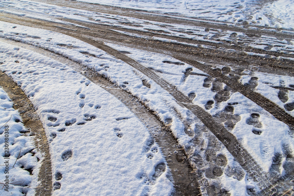 Traces of cars in the snow as a background