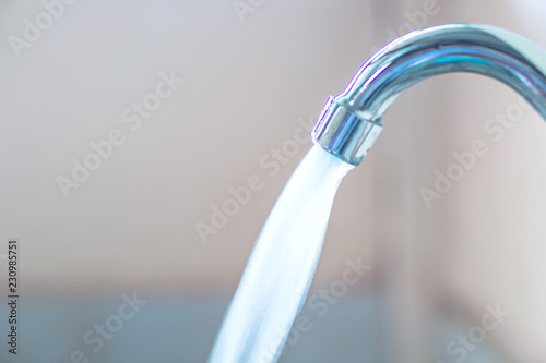 close up water runing from faucet