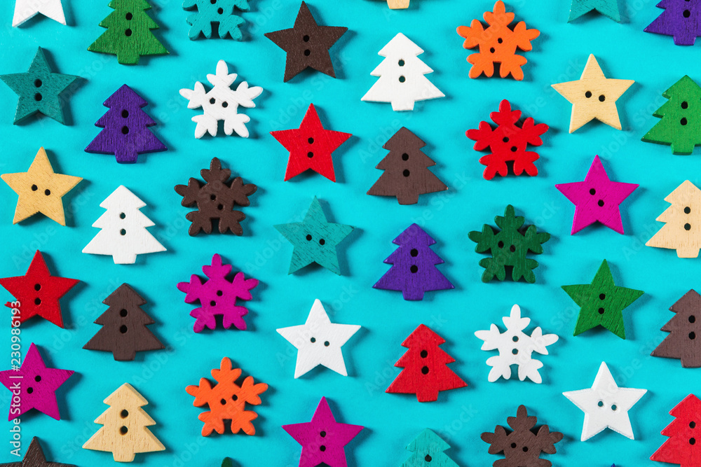 wooden buttons made of wood for the Christmas holiday. Christmas trees, stars, snowflakes. wooden buttons made of wood for the Christmas holiday. Christmas trees, stars, snowflakes.