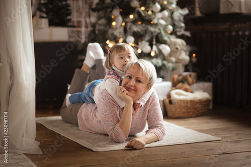 Toddler girl Down syndrome playing with mother