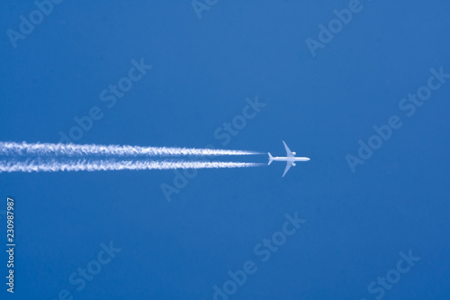 Bilde på lerret Airplane big two engines aviation airport contrail clouds