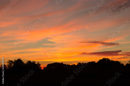 dark sunset with crimson clouds