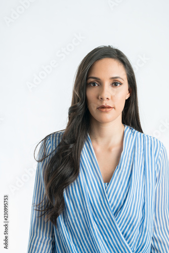 Serious beautiful woman in isolated background