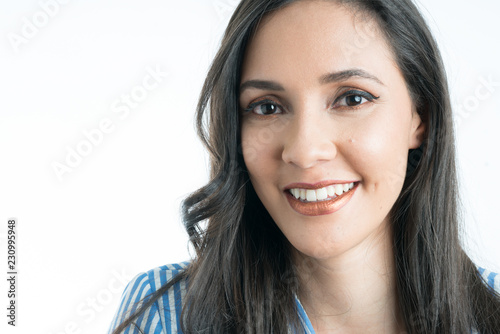 Woman's face smiling looking at camera