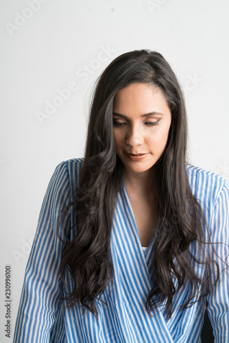 Woman isolated in white background with long hair