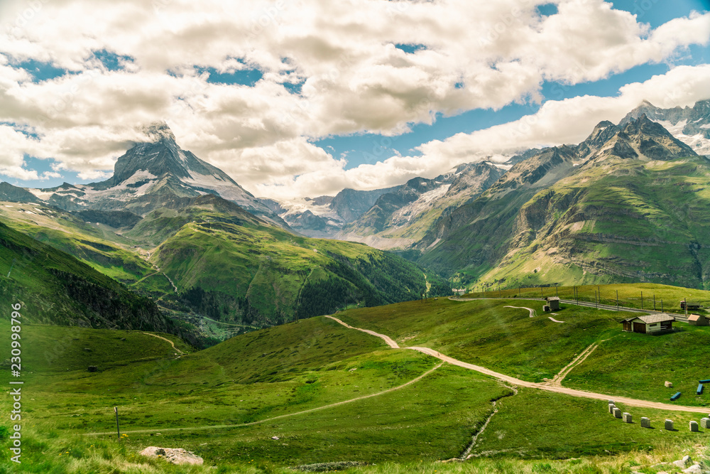 View from Gornegrat in the Alps towards the Matterhorn in summer, Swiss Alps View from Gornegrat in the Alps towards the Matterhorn in summer, Swiss Alps