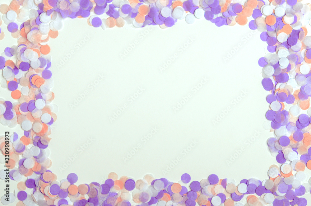 Frame of multicolored confetti on white background. Copy space, top view, flat lay Frame of multicolored confetti on white background. Copy space, top view, flat lay