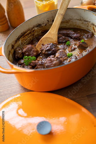 Typical Blegian beef stew flemish carbonades in a orange stew pot