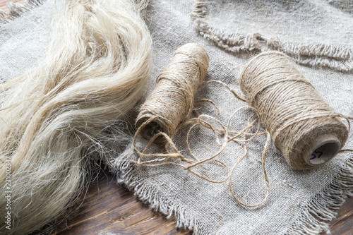 Products from flax on a wooden table. photo