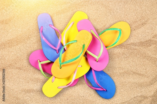 Pairs Of Flip-flops On Beach, vacation concept