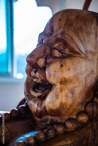 Phra sangkatchai monk statue made from wood in Hyuaplakang temple photo