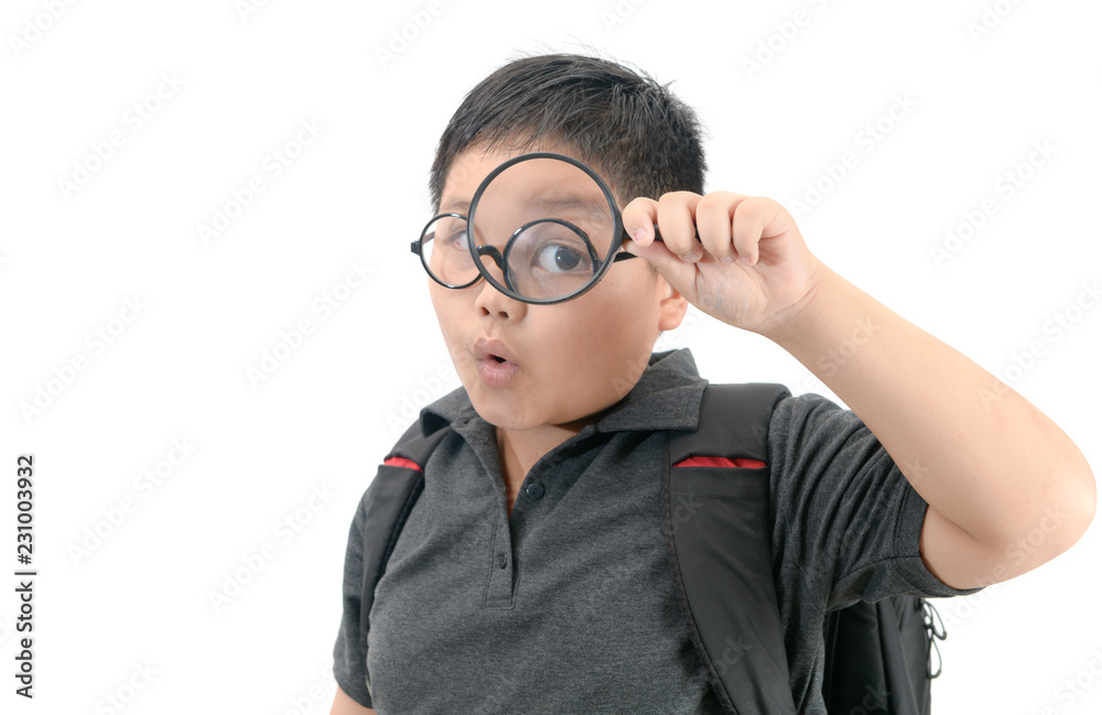 Happy asian fat boy holding magnifying glass. Happy asian fat boy holding magnifying glass.