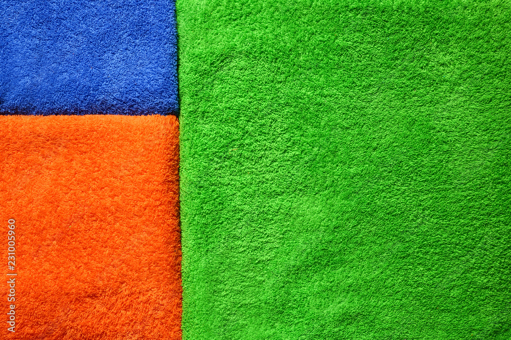 Fototapeta premium Color terry towels as background, closeup