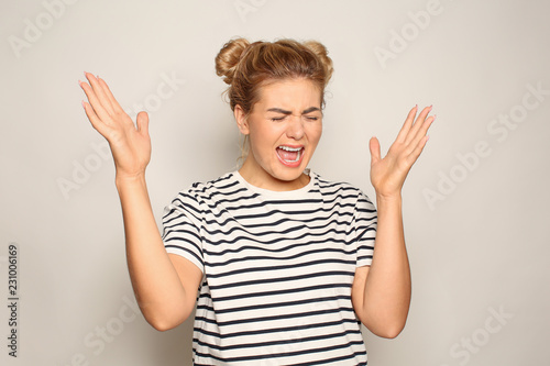 Portrait of irritated young...