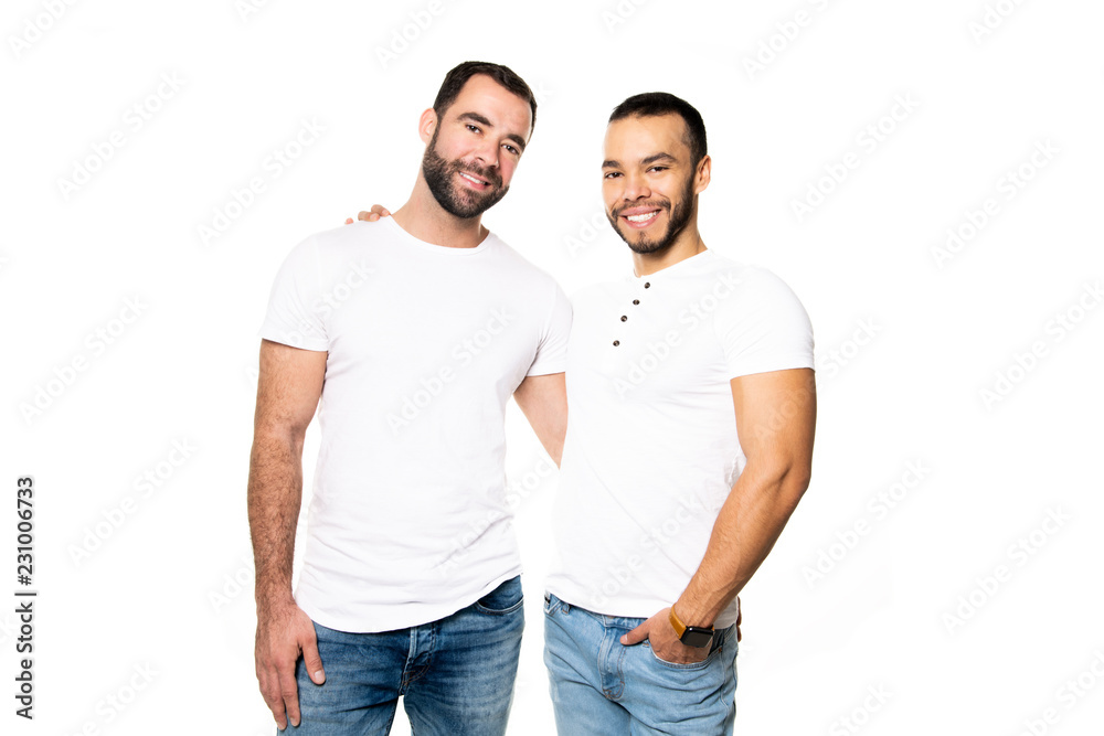 Young homosexuals gay couple love each other on a white background. Young homosexuals gay couple love each other on a white background.