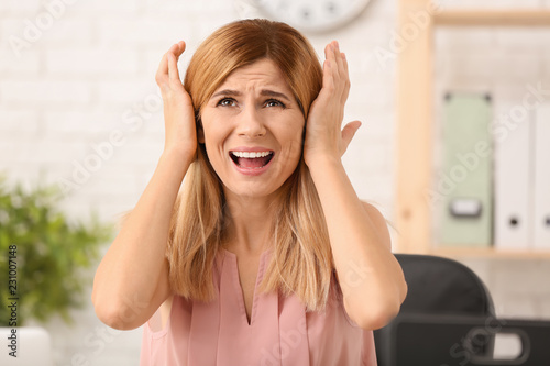 Woman having panic attack at workplace