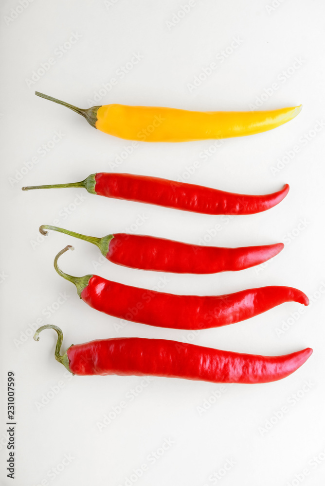 Fresh chili peppers on light background Fresh chili peppers on light background