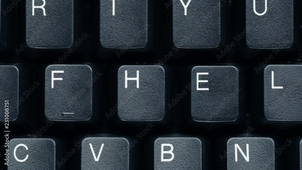 Closeup dolly move above a black computer keyboard with rearranged keys which spell the word help. Closeup dolly move above a black computer keyboard with rearranged keys which spell the word help.